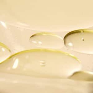 image of droplets on a yellow background. These films are similar to the film former in the viral eye cream that contains sodium silicate.